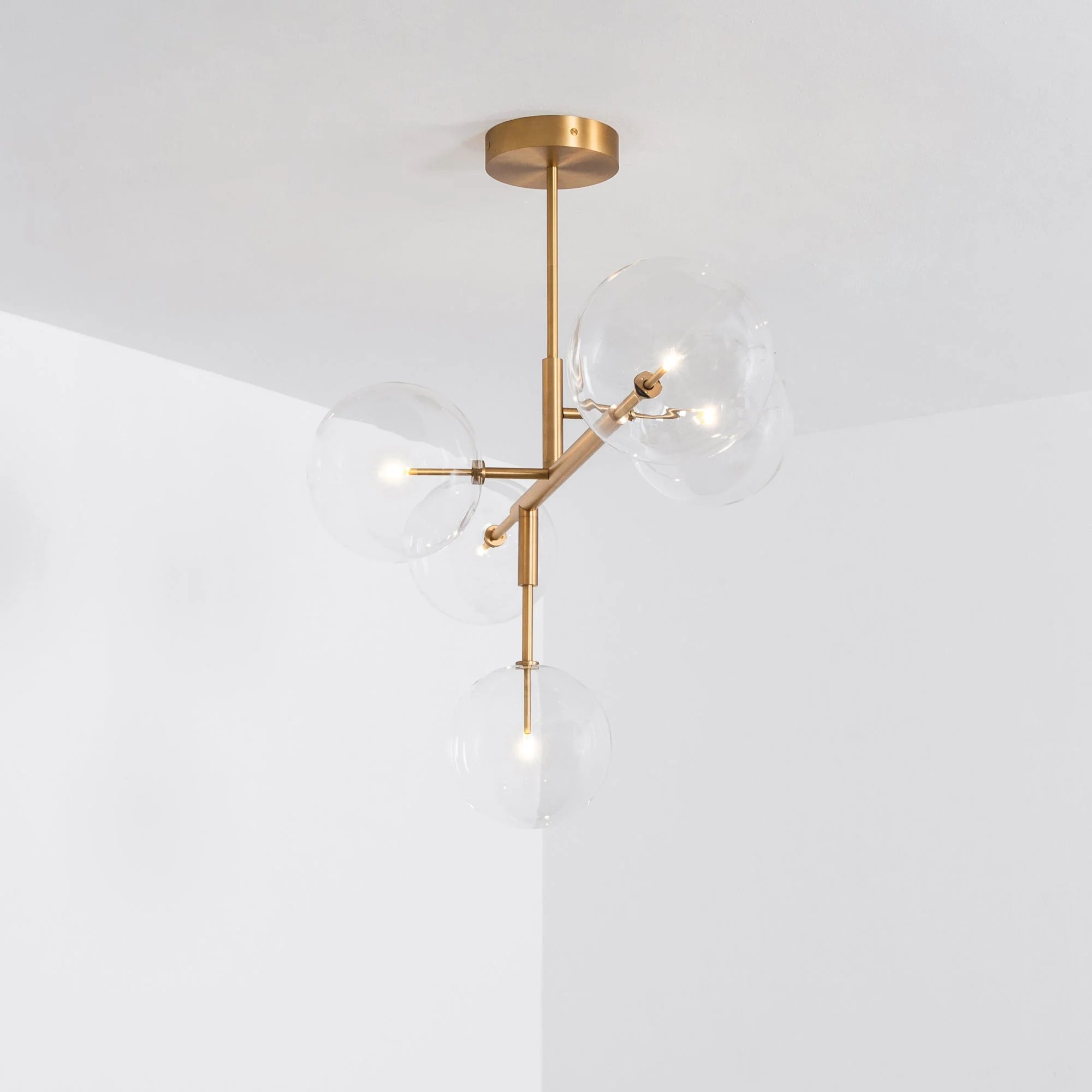 Schwung Axis Burnished Brass Transparent Globe Ceiling Light